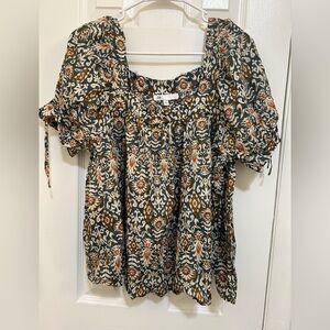 Orange and teal patterned baby doll top